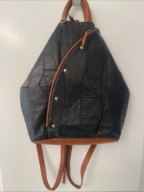 Black Leather Backpack with Brown Trim and Brass Accents